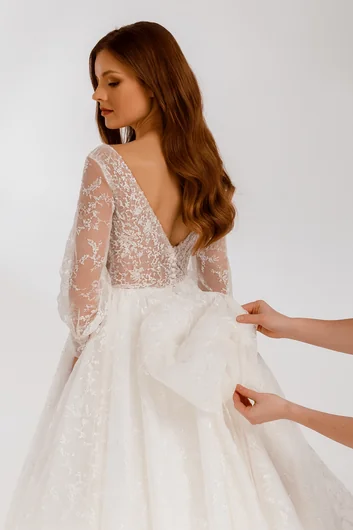 Professional French under-bustle alterations with elegant hidden train attachment